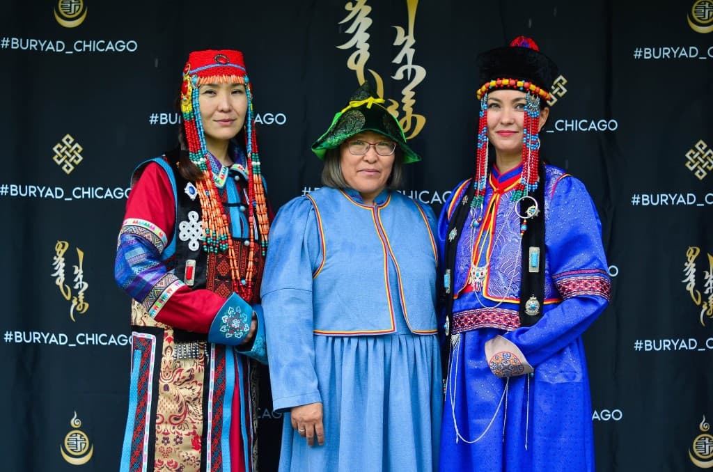 Three women in traditional Buryat clothing at a Buryad Chicago community event.